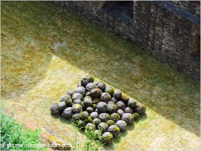 with these stone balls the castle once was attacked