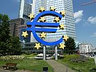 euro sign in front of a highrise