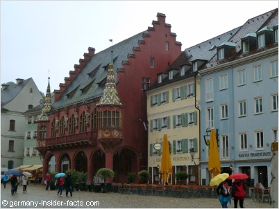 colourful merchants hall and munsterplatz in freiburg