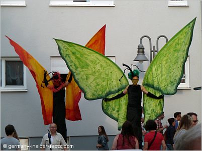 stilt walker with butterfly costume