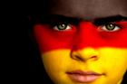 soccer fan with german flag painted on his face