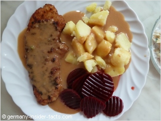 plate with schnitzel, potatoes and beetroot