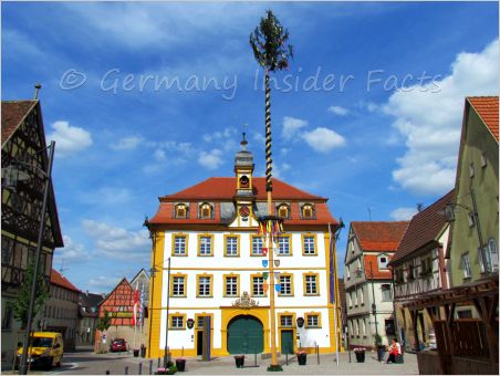 Town hall and May pole in Röttingen