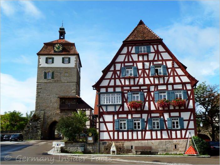 Beautiful medieval half-timber house and an old tower