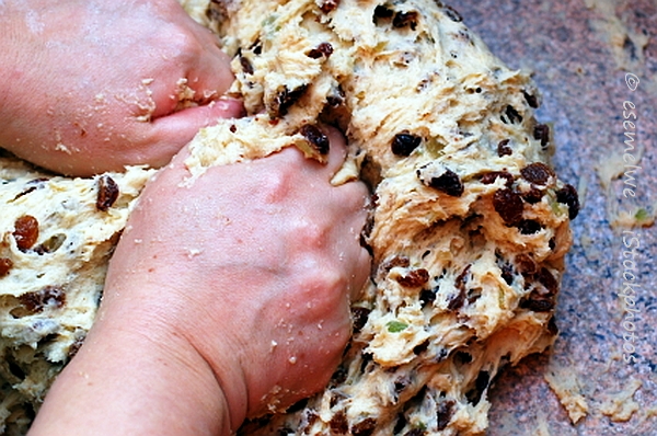 Photo of someone kneading a dough with raisins for a German Christmas Stollen Photo of someone kneading a dough with raisins for a German Christmas Stollen